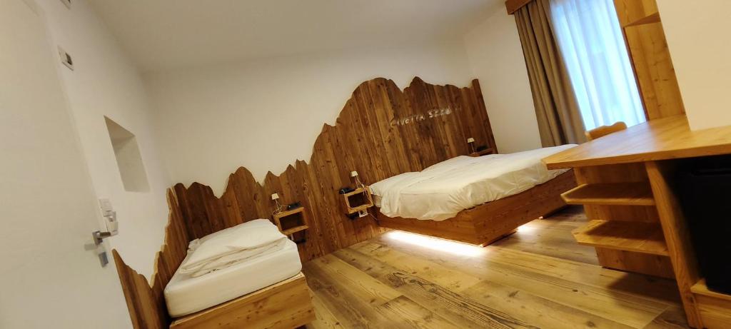 Postel nebo postele na pokoji v ubytování Hotel Venezia