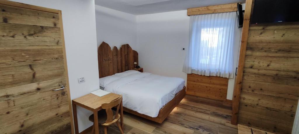 Postel nebo postele na pokoji v ubytování Hotel Venezia