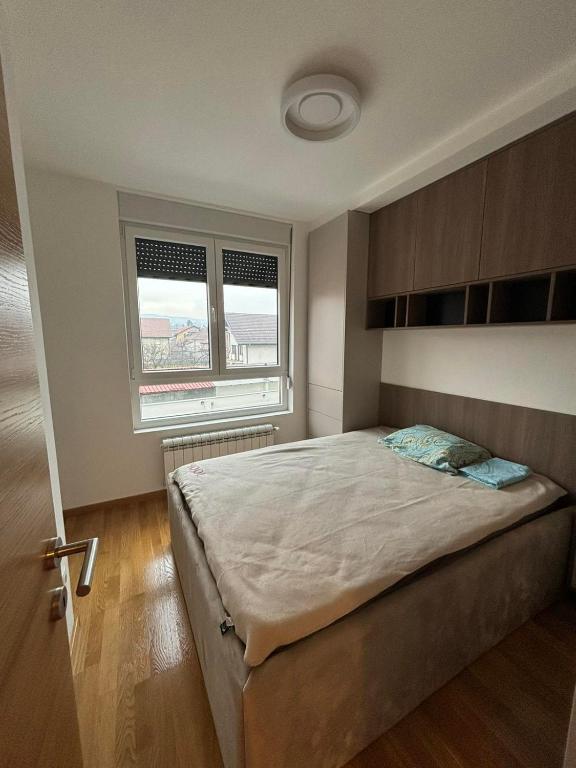 Postel nebo postele na pokoji v ubytování Apartman Akademska Četvrt