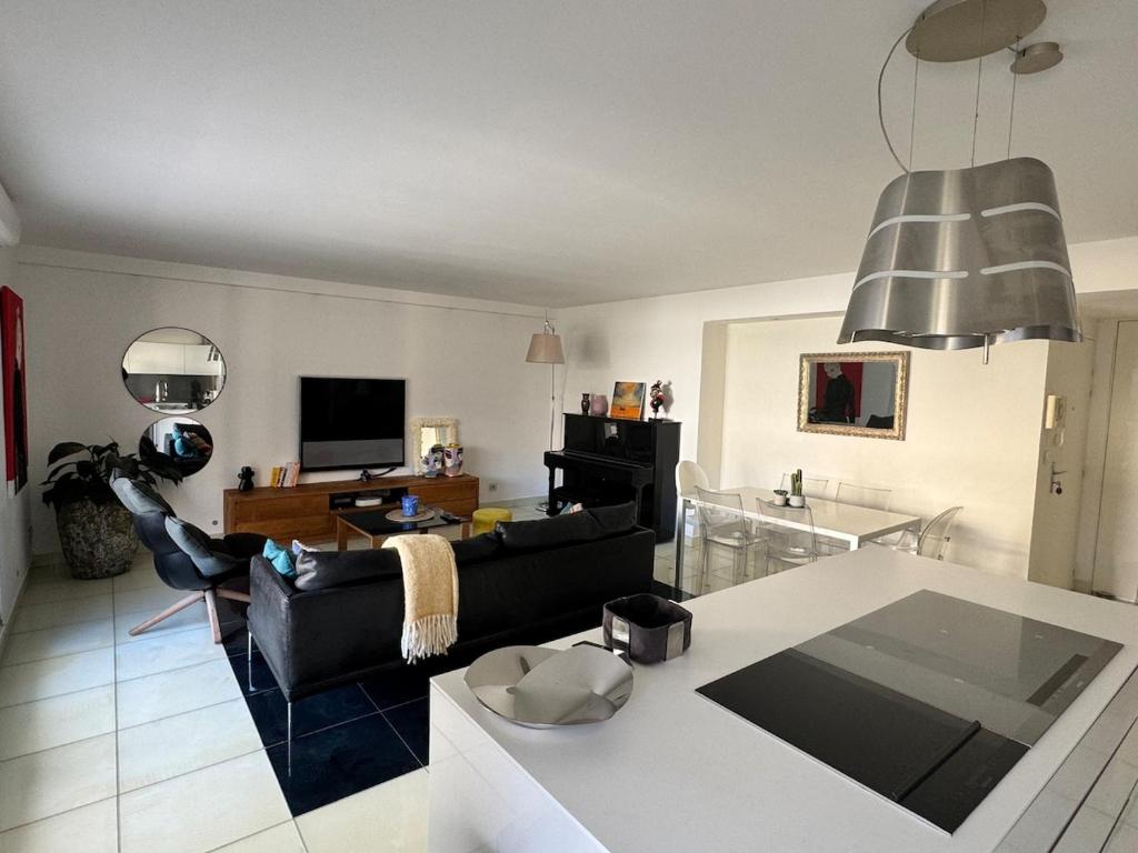 a living room with a couch and a table at Luxury apartment in Marseille