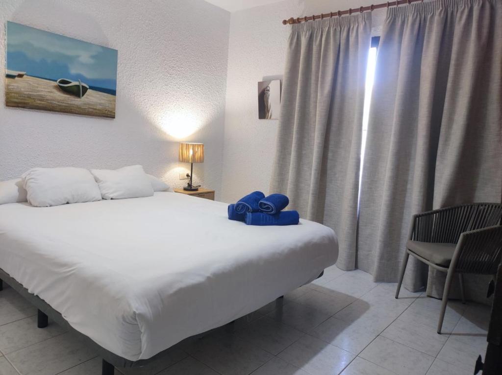 Posteľ alebo postele v izbe v ubytovaní NUEVA NERJA 22 MENYBER