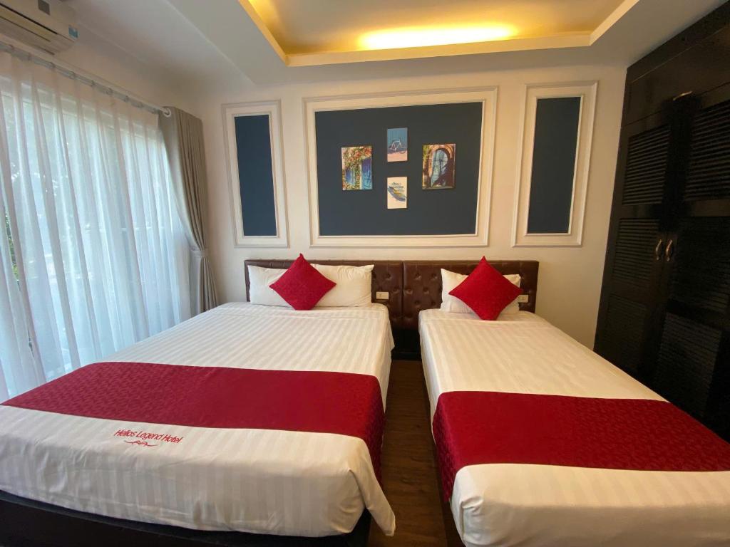 Postel nebo postele na pokoji v ubytování Eclipse Legend Hotel