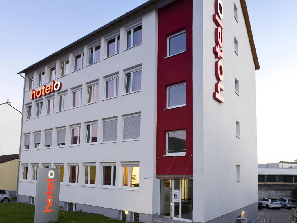 a hotel with a sign on the side of a building at hotelo Heidelberg in Heidelberg