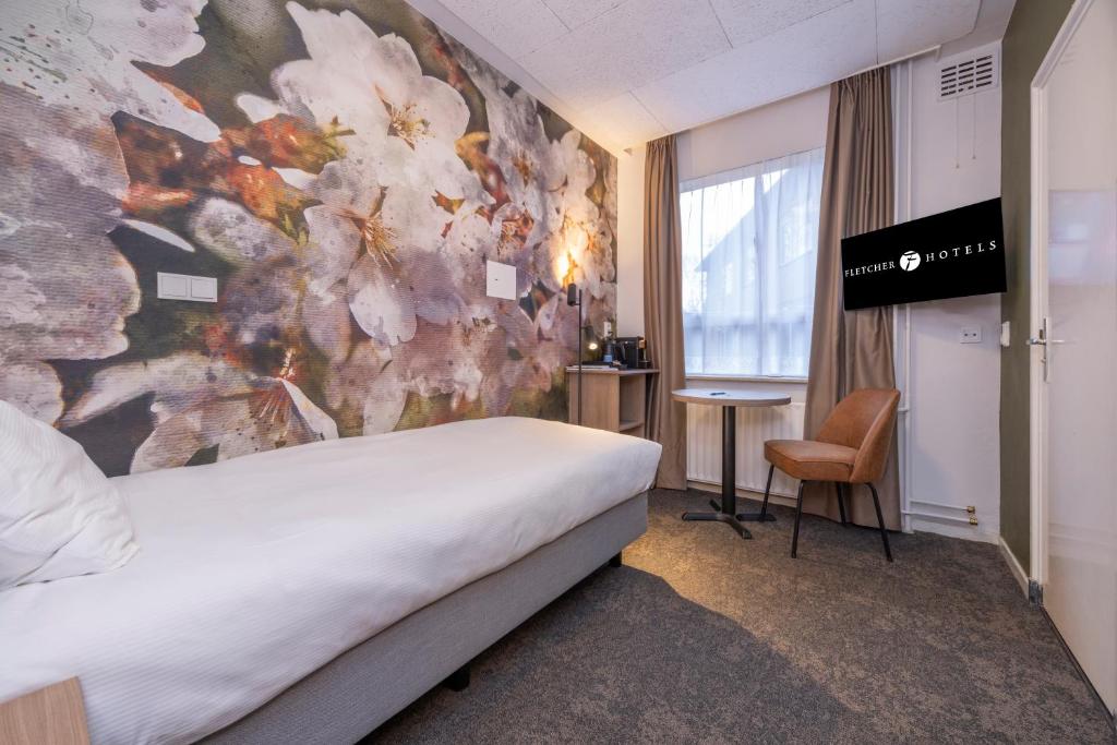Postel nebo postele na pokoji v ubytování Fletcher Parkhotel Val Monte
