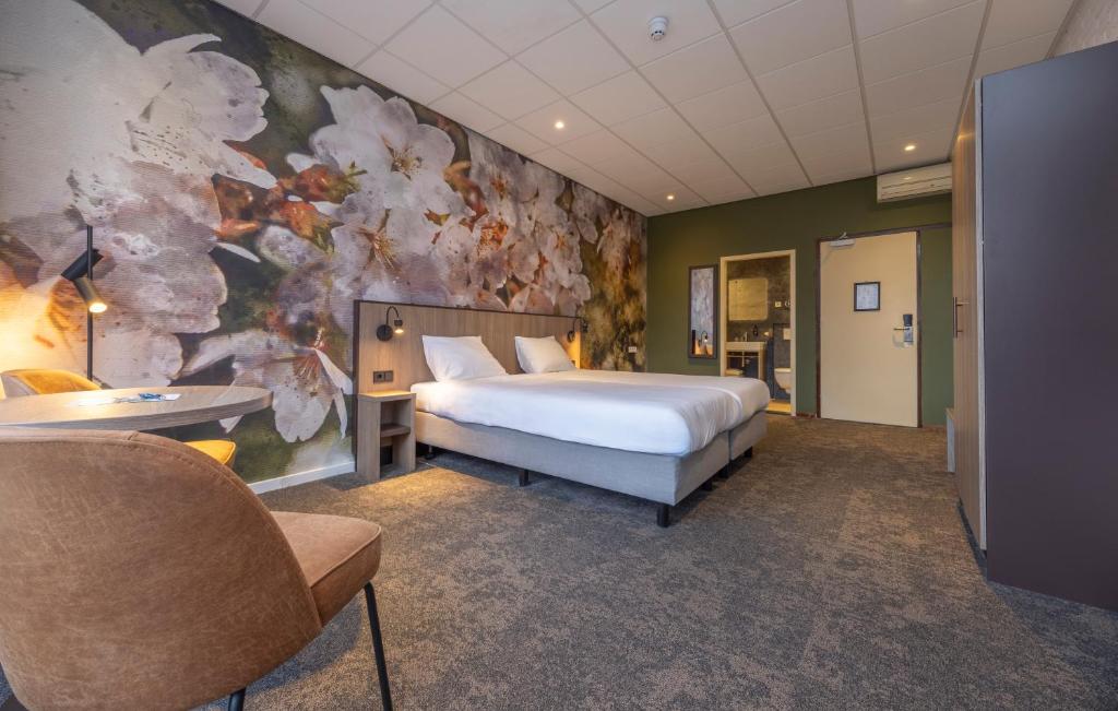 Postel nebo postele na pokoji v ubytování Fletcher Parkhotel Val Monte