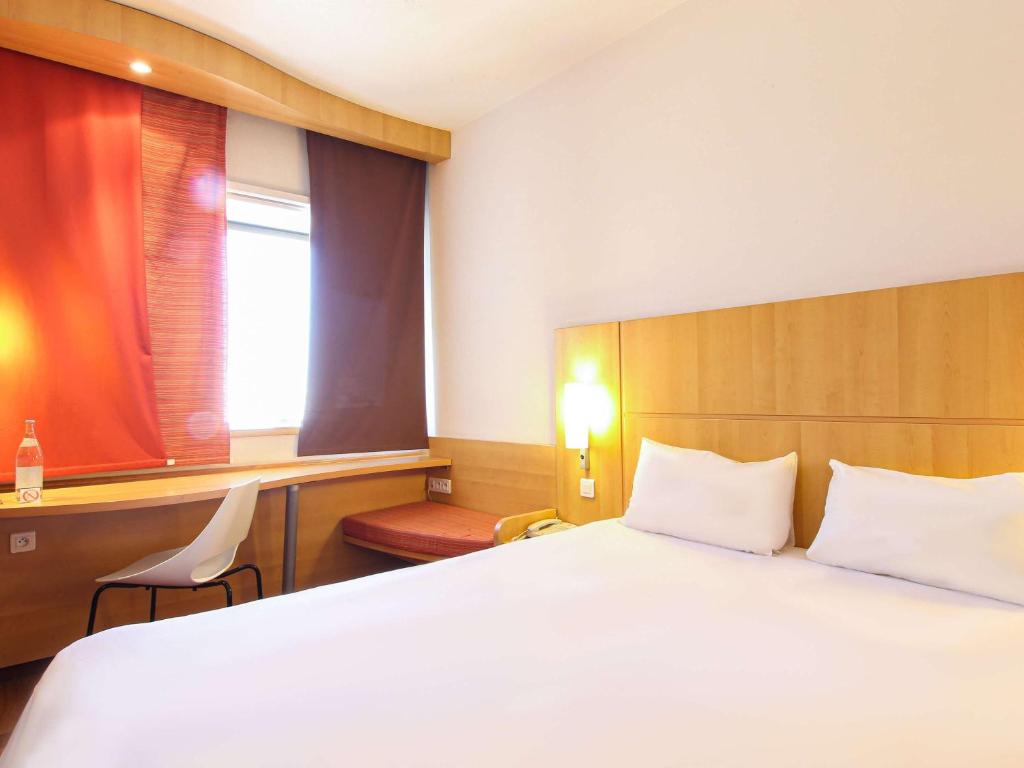 Postel nebo postele na pokoji v ubytování Ibis Tunis