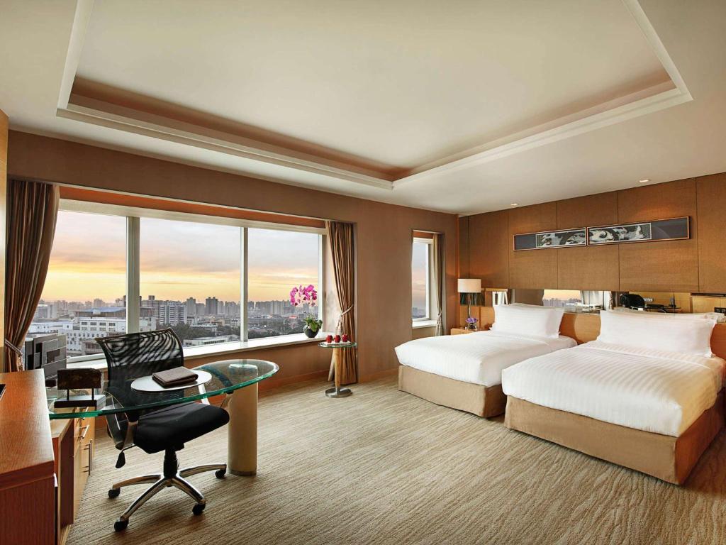 Postel nebo postele na pokoji v ubytování Sofitel Xi'an On Renmin Square