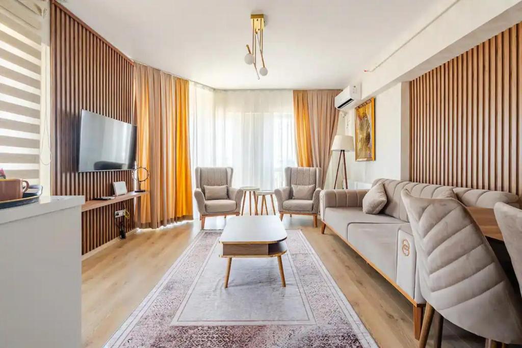 TV a/nebo společenská místnost v ubytování Deluxe King Suite MAI35