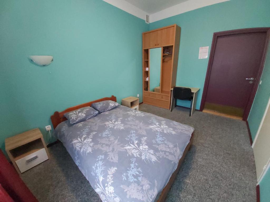 Postel nebo postele na pokoji v ubytování Gamma Hotel