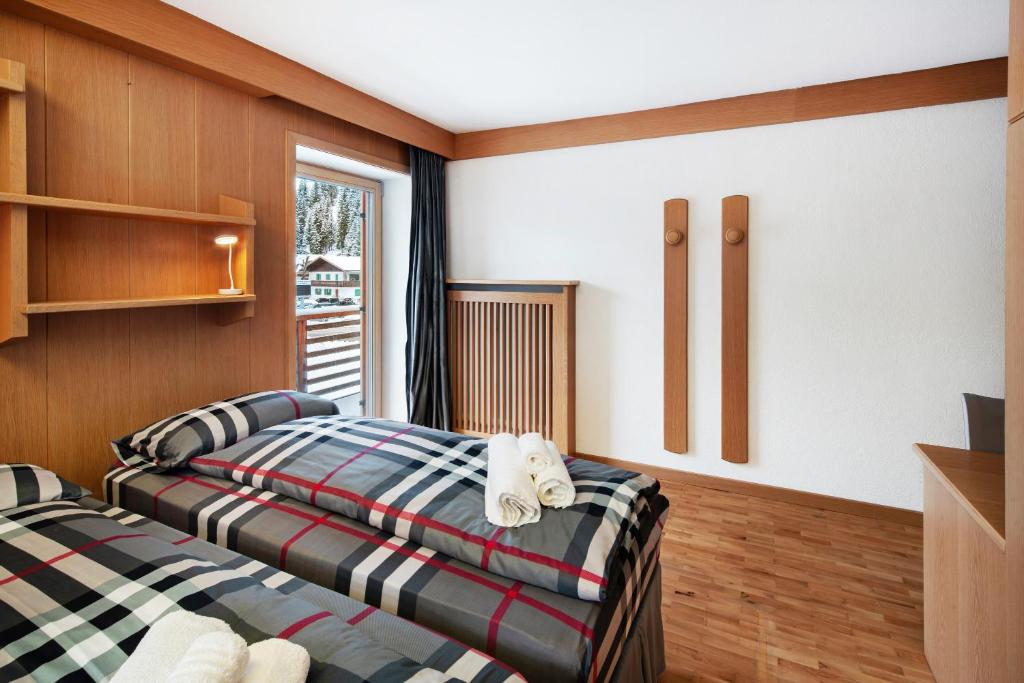 Postel nebo postele na pokoji v ubytování Guesthouse Canazei