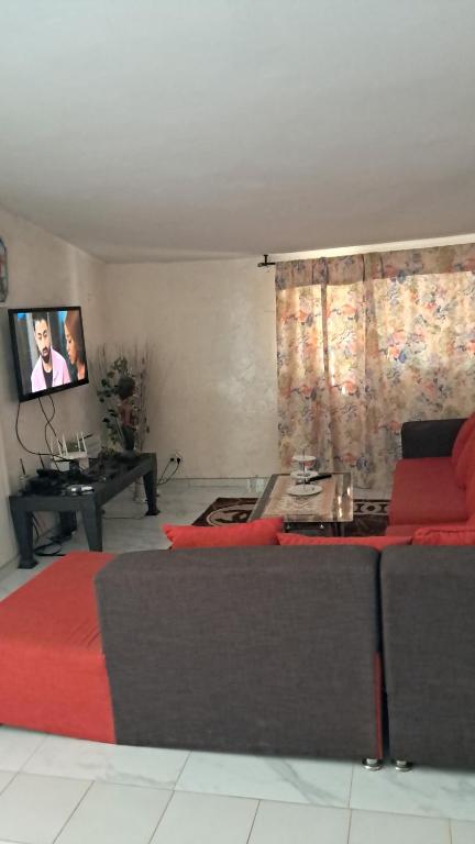 Zona d'estar a Apparemment à Saly