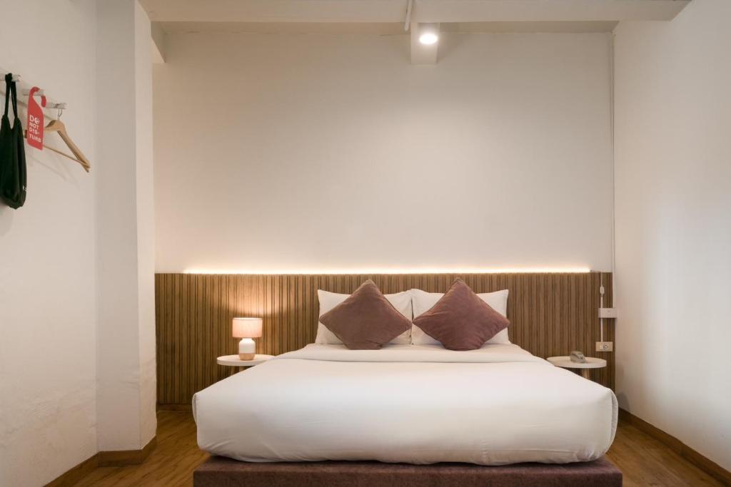 Postel nebo postele na pokoji v ubytování Hotel PAPA Bangkok Siriraj
