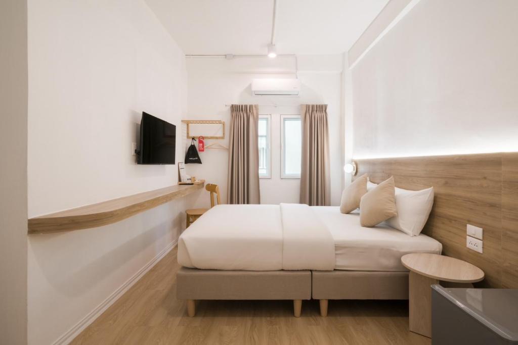 Postel nebo postele na pokoji v ubytování Hotel PAPA Bangkok Siriraj