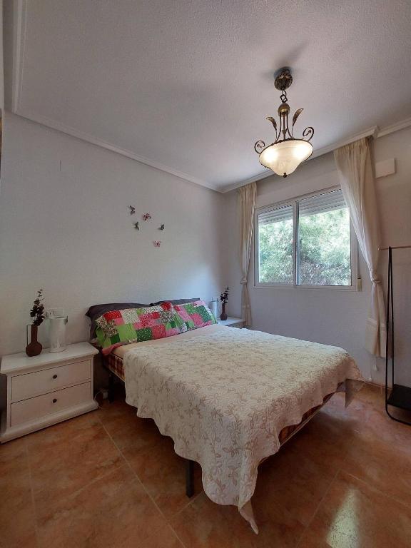 Postel nebo postele na pokoji v ubytování Bungalow muy cerca de la playa