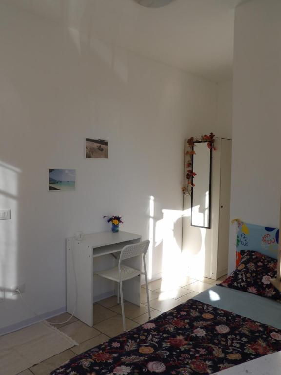Postel nebo postele na pokoji v ubytování Affittacamere La Fortezza