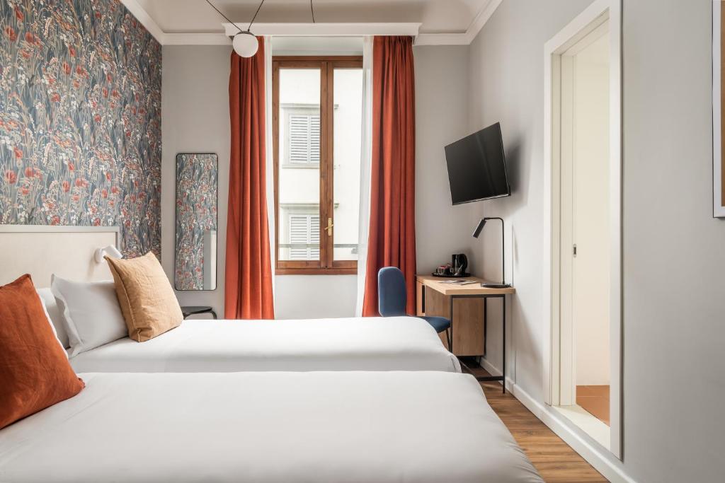 Postel nebo postele na pokoji v ubytování BYPILLOW Goldoni