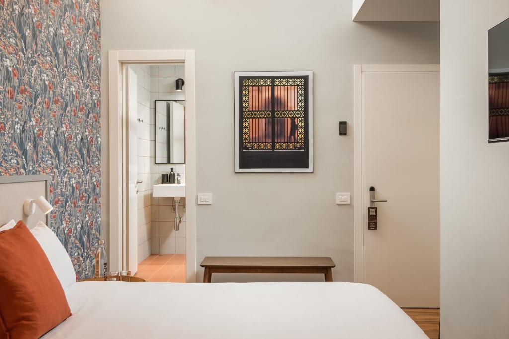Postel nebo postele na pokoji v ubytování BYPILLOW Goldoni