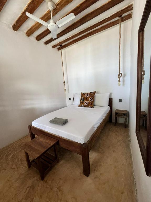 Postel nebo postele na pokoji v ubytování Mango Beach House