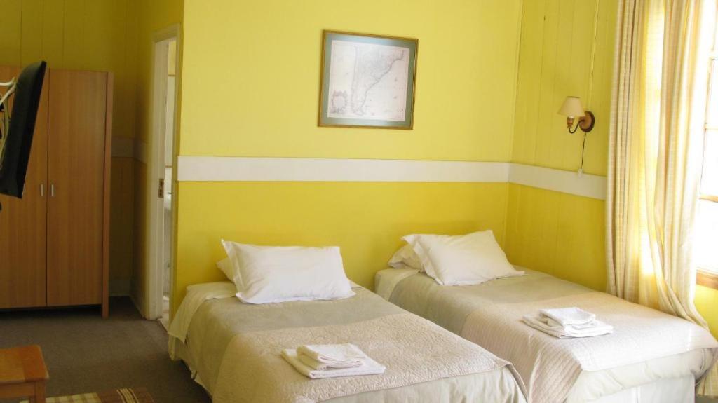 Postel nebo postele na pokoji v ubytování Yendegaia House