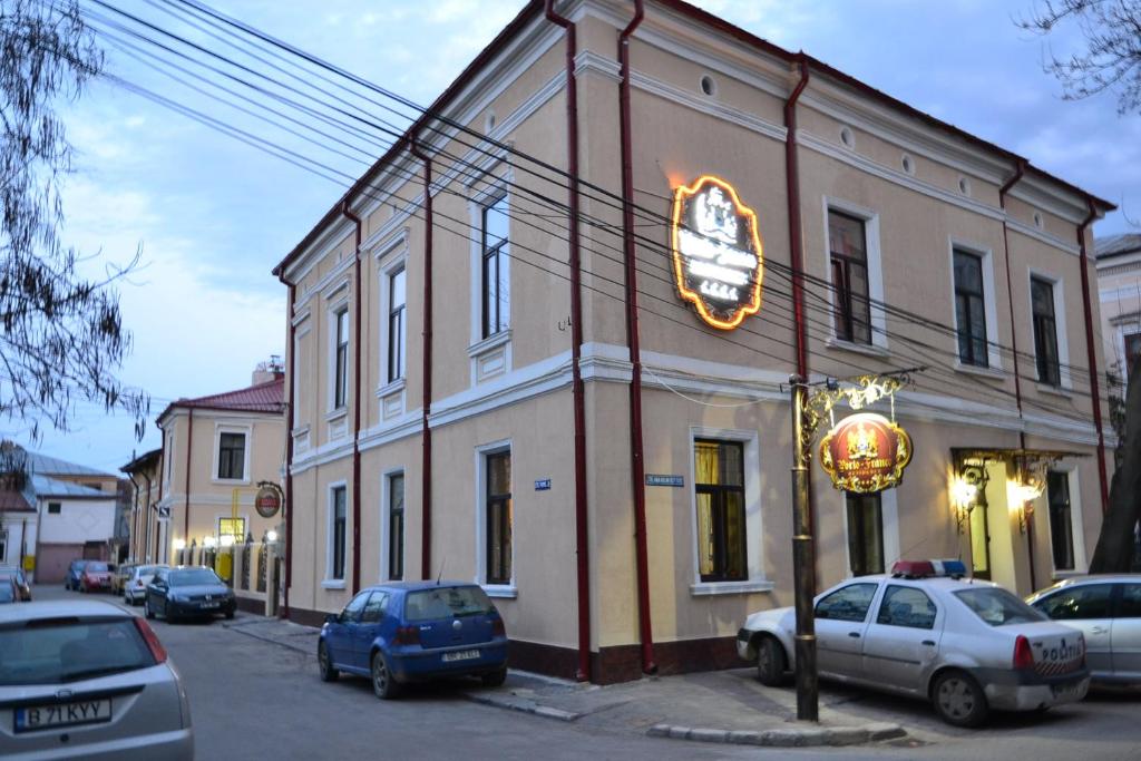 a building with a sign on the side of it at Porto Franco Residence in Brăila