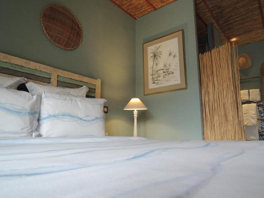 Postel nebo postele na pokoji v ubytování Via Bahia - Maison d'hôtes