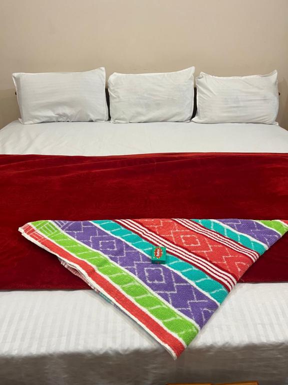 Postel nebo postele na pokoji v ubytování VARIYATH HOMESTAY THIRUNELLi
