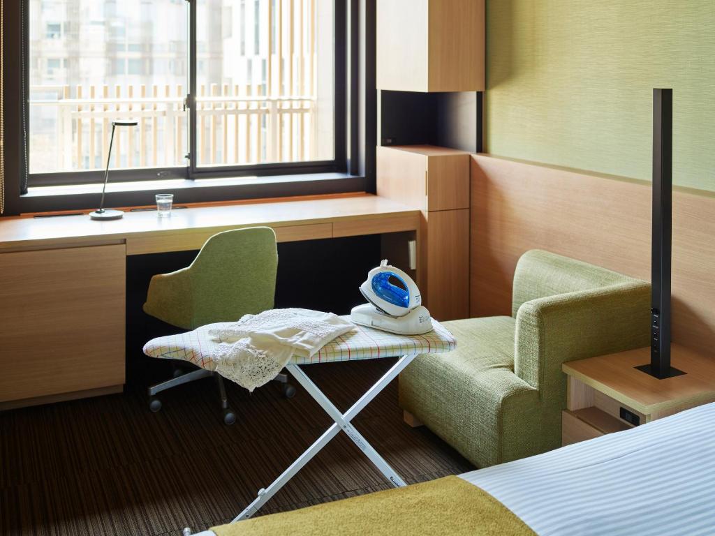 Postel nebo postele na pokoji v ubytování Mitsui Garden Hotel Kashiwa-No-Ha - Chiba