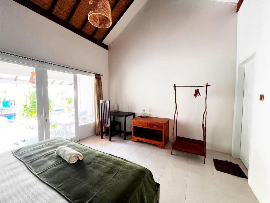 Postel nebo postele na pokoji v ubytování Gilibong Bungalows