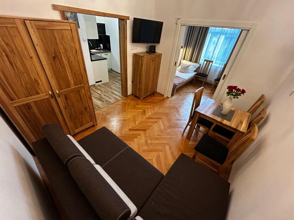 a living room with a couch and a table at Old Cracow Apartment I in Krakow