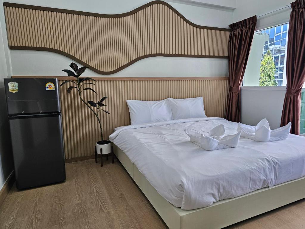 Postel nebo postele na pokoji v ubytování Lub Nai Hostel