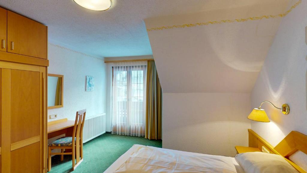 Postel nebo postele na pokoji v ubytování Bräuhaus Appartements