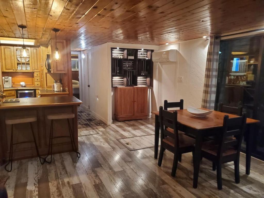a kitchen and dining room with a table and chairs at Float and Relax ON the Water Float Home in Forked River