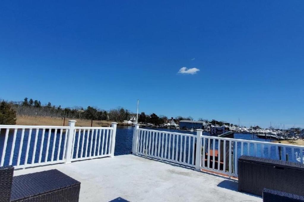 a balcony with a view of the water at Float and Relax ON the Water Float Home in Forked River