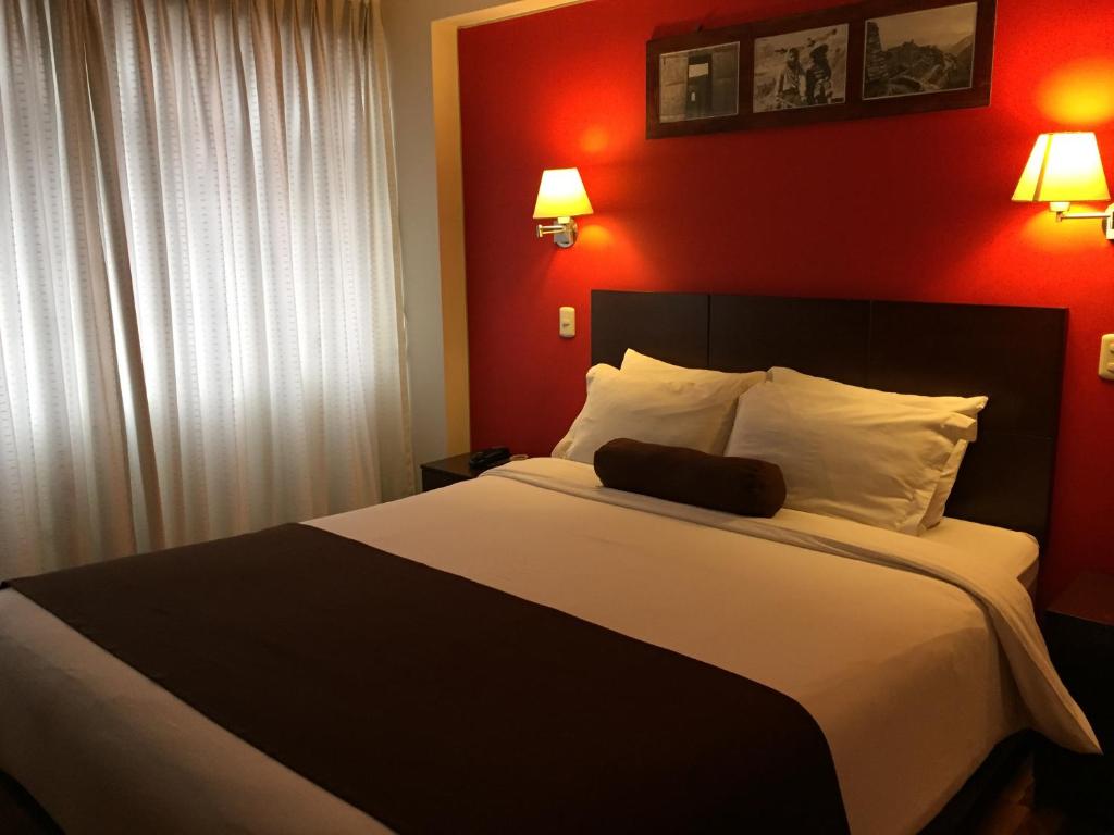 Postel nebo postele na pokoji v ubytování Kapac Inn Hotel