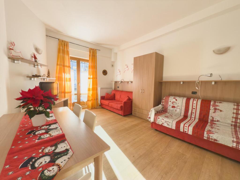 Ένα ή περισσότερα κρεβάτια σε δωμάτιο στο Monolocale sulle piste da sci