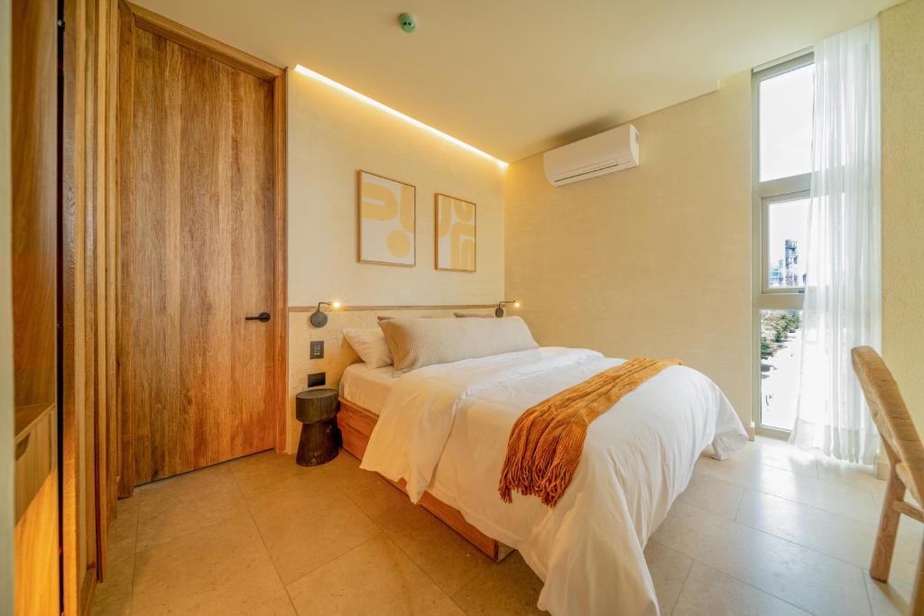 Postel nebo postele na pokoji v ubytování Moabi Hotel