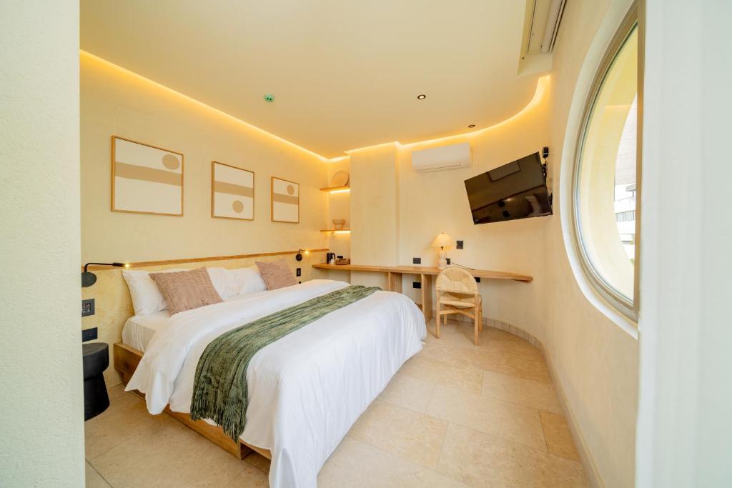 Postel nebo postele na pokoji v ubytování Moabi Hotel