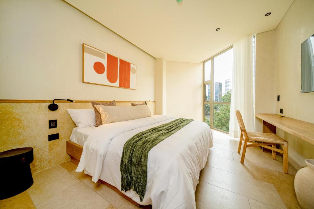 Postel nebo postele na pokoji v ubytování Moabi Hotel