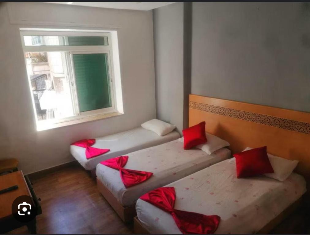 Ένα ή περισσότερα κρεβάτια σε δωμάτιο στο Hotel Astoria Tanger