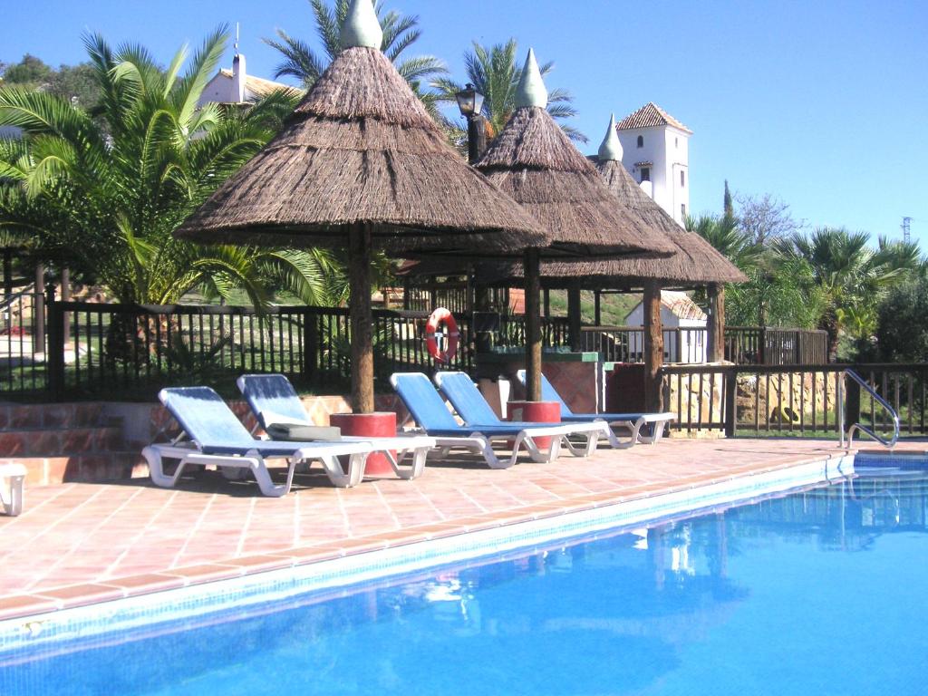 Bazén v ubytování Ground floor apartment, with spectacular pool in rural holiday park FINCA EL MORALEJO nebo v jeho okolí