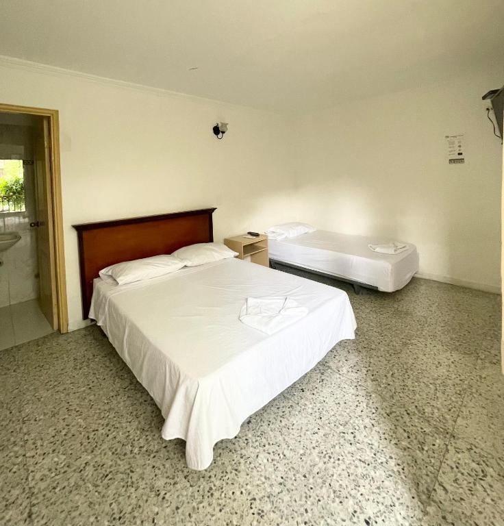 Postel nebo postele na pokoji v ubytování Hotel Casa Fátima