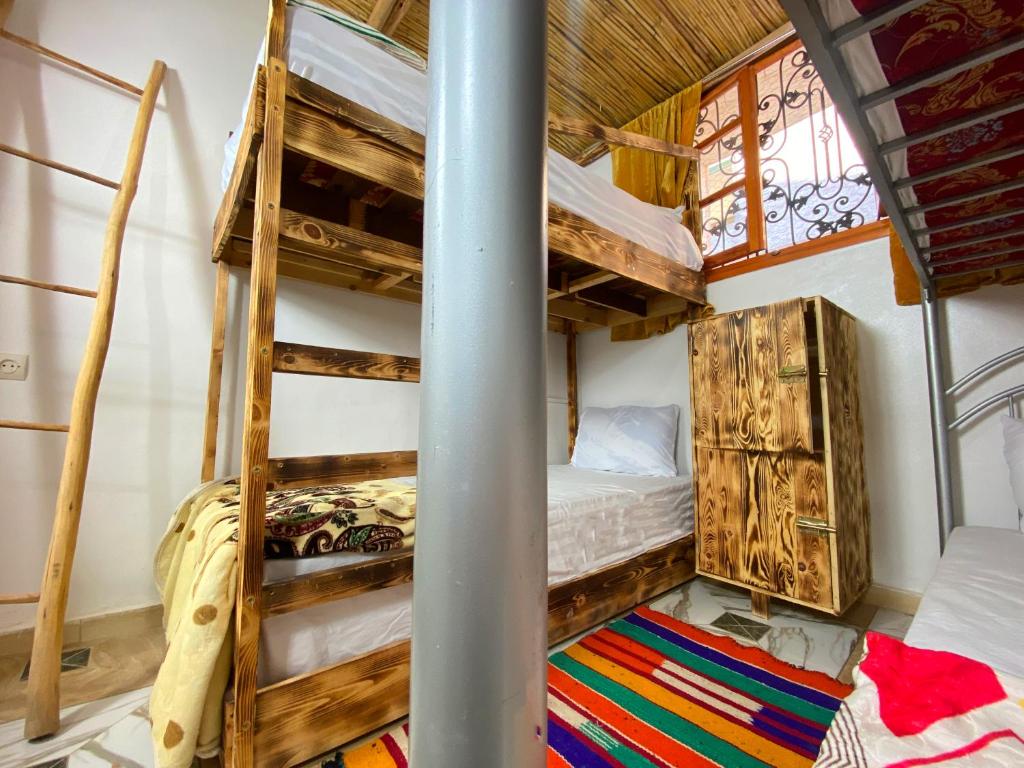 Postel nebo postele na pokoji v ubytování Aftass Hostel