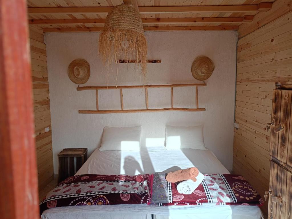 Postel nebo postele na pokoji v ubytování Aftass Hostel