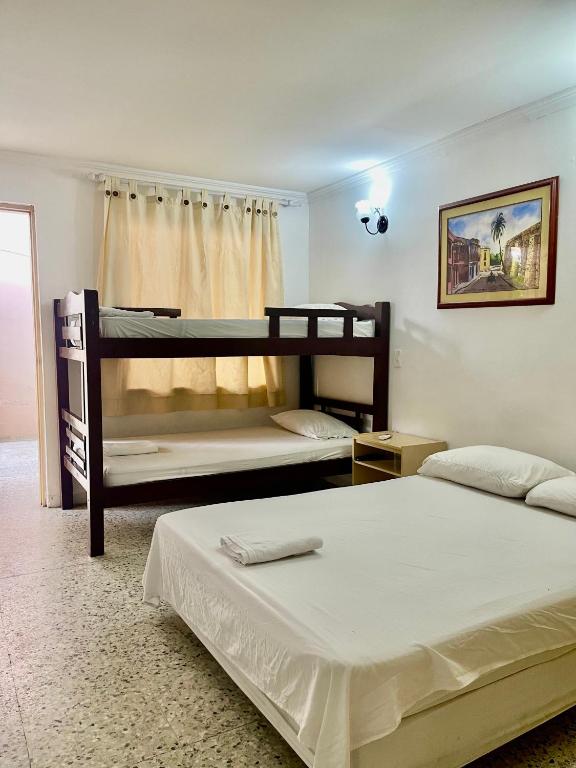 Postel nebo postele na pokoji v ubytování Hotel Casa Fátima