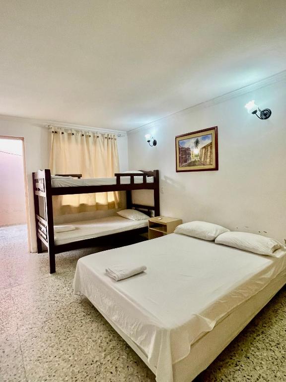 Postel nebo postele na pokoji v ubytování Hotel Casa Fátima