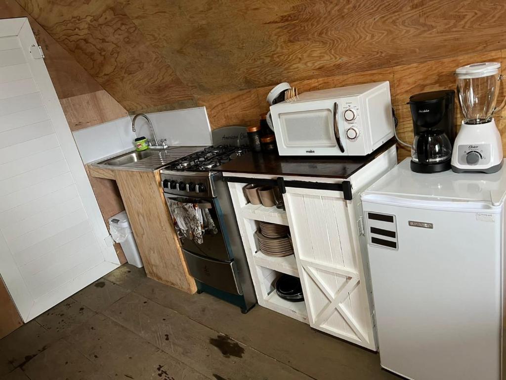 Kuchyň nebo kuchyňský kout v ubytování Cabaña Western Alpine Hn