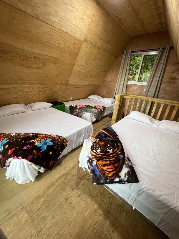 Postel nebo postele na pokoji v ubytování Cabaña Western Alpine Hn