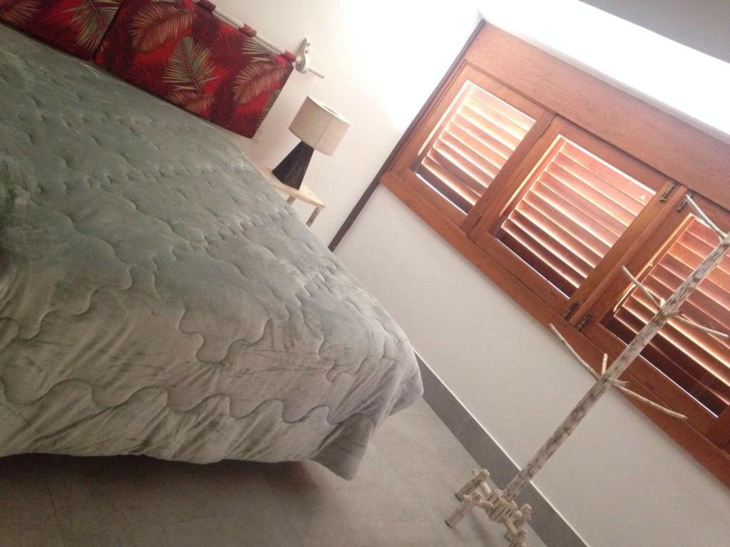 Postel nebo postele na pokoji v ubytování D'ajuda Flat
