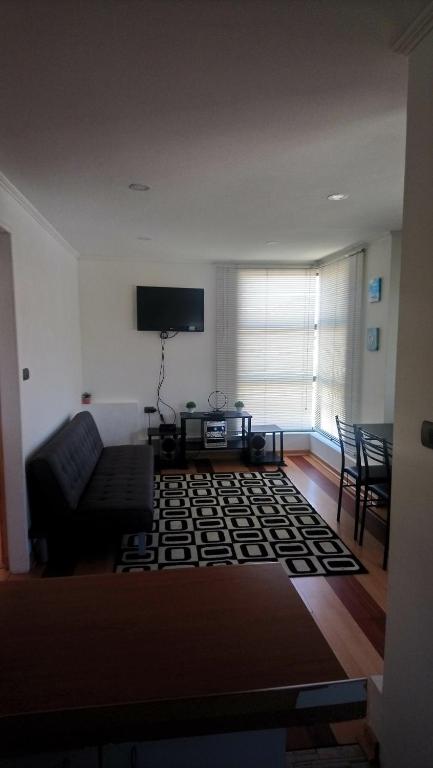 TV a/nebo společenská místnost v ubytování Depto Cerca Reloj Flores Viña