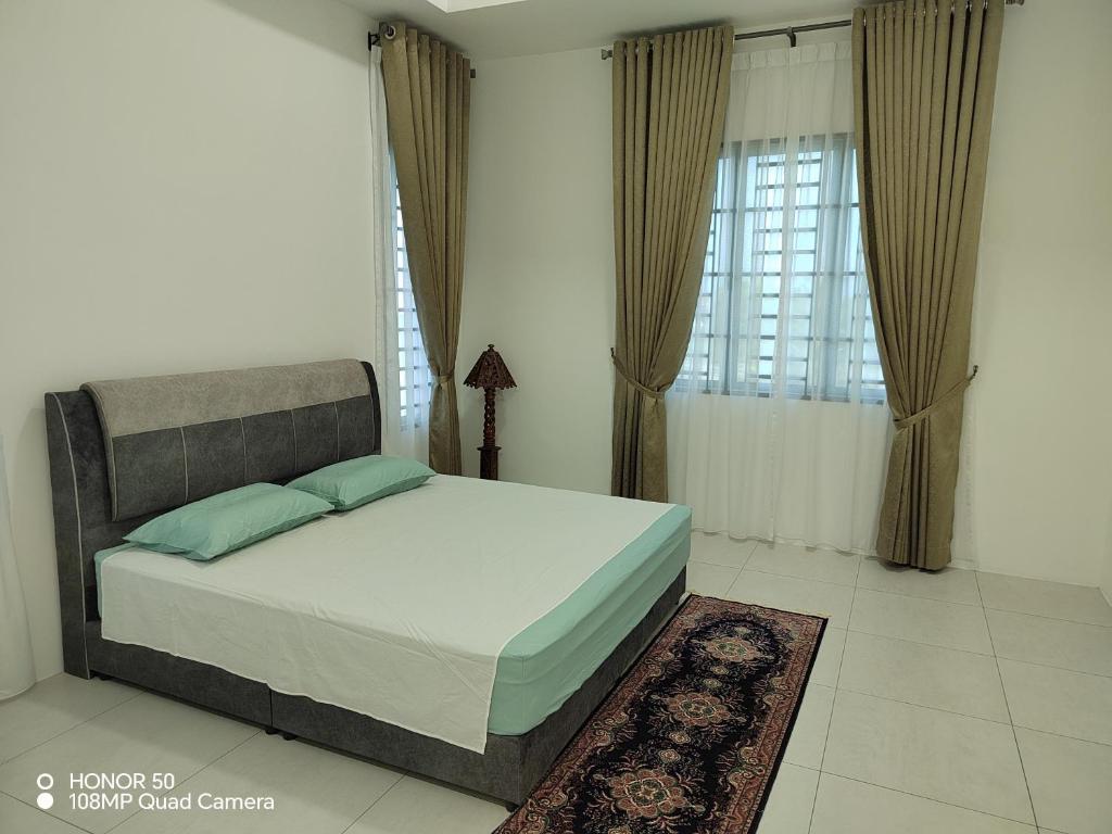 Ένα ή περισσότερα κρεβάτια σε δωμάτιο στο Mars Homestay